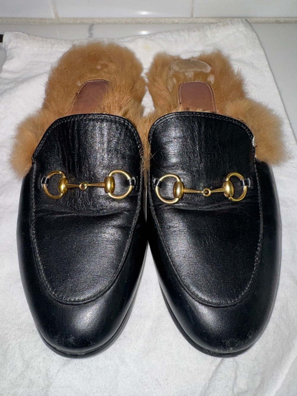 Gucci Princetown leather mules featuring signature gold-tone horsebit hardware